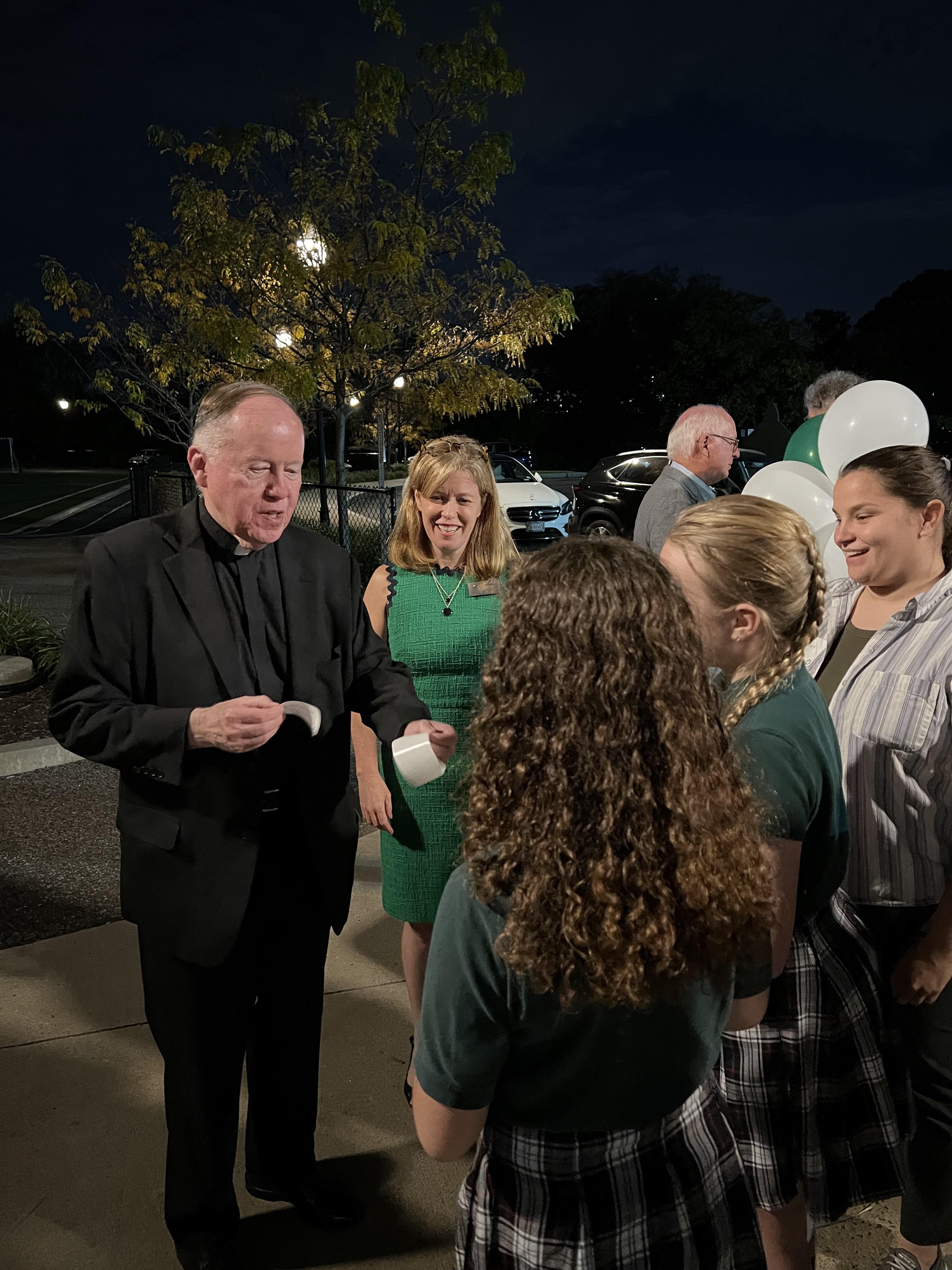 fr. leahy and students